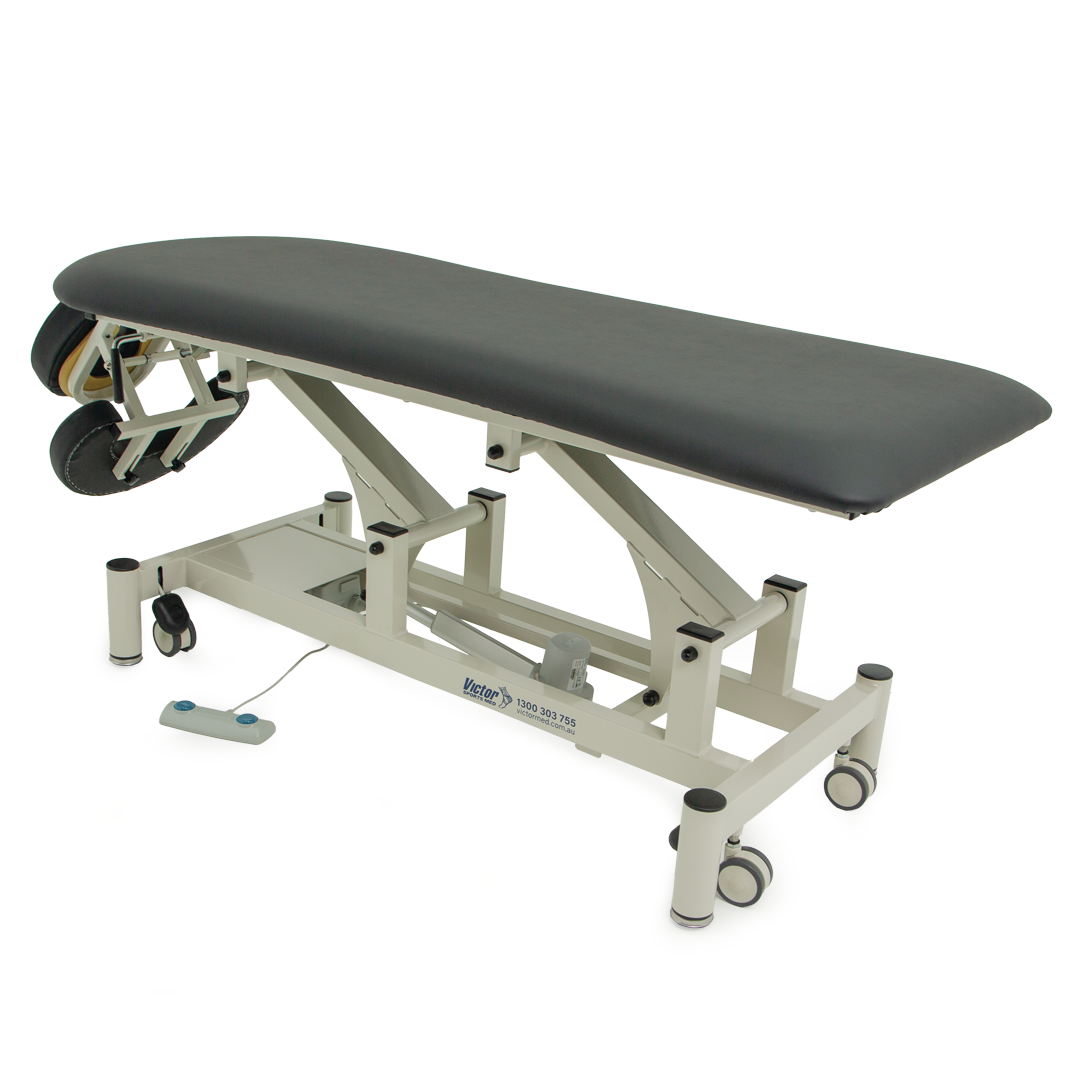 Contoured massage table with adjustable face rest and arm cradle