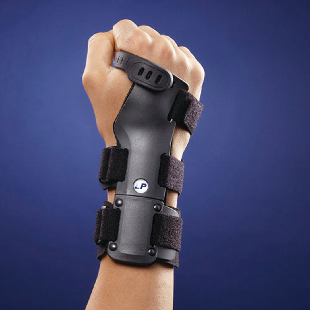Rigid wrist brace with ventilated pad and finger strap