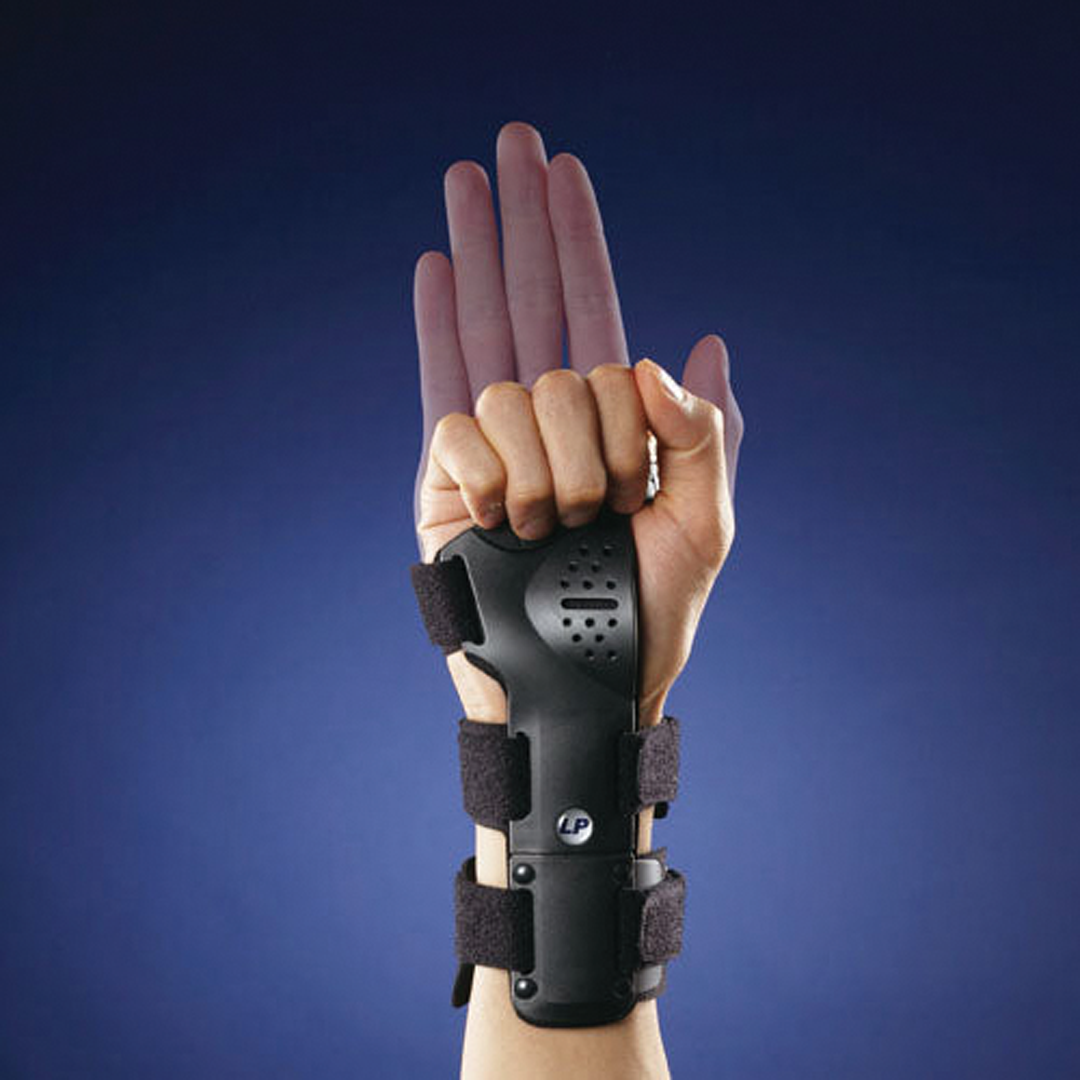 Rigid wrist brace with ventilated pad and finger strap